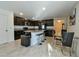 Open kitchen with island, stainless steel appliances, and dining area at 4815 Rigging St, Haines City, FL 33844