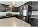 Spacious kitchen with stainless steel appliances and granite countertop at 4815 Rigging St, Haines City, FL 33844