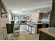 Modern kitchen with an island, stainless steel appliances, and a breakfast bar at 4815 Rigging St, Haines City, FL 33844