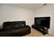 Media room with large TV and reclining sofa at 4815 Rigging St, Haines City, FL 33844