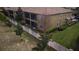 View of the back of the townhome and screened in porch at 8979 Azalea Sands Ln, Davenport, FL 33896