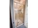 Modern bathroom featuring a glass-enclosed shower with tiled walls and updated fixtures at 8979 Azalea Sands Ln, Davenport, FL 33896