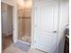 This bathroom has a tiled standup shower and a neutral color scheme at 8979 Azalea Sands Ln, Davenport, FL 33896