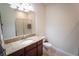 Well-maintained bathroom featuring granite countertop, vanity, tile flooring, and shower at 8979 Azalea Sands Ln, Davenport, FL 33896