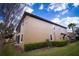 Exterior view of a two-story home with a well-maintained lawn, and a screen patio at 8979 Azalea Sands Ln, Davenport, FL 33896