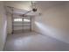 Clean garage with white walls and an automatic door opener at 8979 Azalea Sands Ln, Davenport, FL 33896