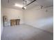 Spacious garage with white walls, storage, and essential utilities at 8979 Azalea Sands Ln, Davenport, FL 33896