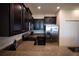 The cozy kitchen features granite countertops and stainless steel appliances at 8979 Azalea Sands Ln, Davenport, FL 33896