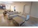 Spacious living room features neutral decor and a comfortable sectional sofa at 8979 Azalea Sands Ln, Davenport, FL 33896