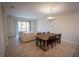 Open-concept living room with dining area, large sectional sofa, and tile flooring at 8979 Azalea Sands Ln, Davenport, FL 33896