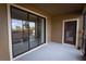 Outdoor patio featuring neutral concrete flooring, door to outside, and access to main house at 8979 Azalea Sands Ln, Davenport, FL 33896