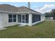 Screened patio and grassy backyard shown here at 9875 Sw 55Th Ct, Ocala, FL 34476