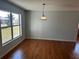 Bright dining room with wood-look floors and large window at 9875 Sw 55Th Ct, Ocala, FL 34476
