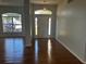 Bright entryway with hardwood floors and views to the backyard at 9875 Sw 55Th Ct, Ocala, FL 34476