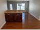 Kitchen with wood cabinets, tile countertops, and breakfast bar at 9875 Sw 55Th Ct, Ocala, FL 34476