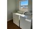 Laundry room with washer, dryer, and utility sink at 9875 Sw 55Th Ct, Ocala, FL 34476
