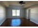 Large living room with hardwood floors and ceiling fan at 9875 Sw 55Th Ct, Ocala, FL 34476