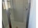 Shower stall with glass door and tiled walls at 9875 Sw 55Th Ct, Ocala, FL 34476