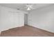 Comfortable bedroom with neutral tones, ceiling fan and ample closet space at 3623 Worth Cir, The Villages, FL 32162