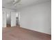 Bright bedroom with walk-in closet and neutral carpeting at 3623 Worth Cir, The Villages, FL 32162