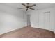 Spacious bedroom features carpet, closet, ceiling fan and natural light at 3623 Worth Cir, The Villages, FL 32162