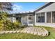 Charming home featuring an enclosed lanai and landscaped backyard at 3623 Worth Cir, The Villages, FL 32162