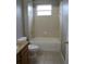 The bathroom features a tiled shower and tub combo at 10198 Oak Crest Rd, Orlando, FL 32829