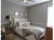 Comfortable bedroom with bed, bedside table, and neutral decor at 10198 Oak Crest Rd, Orlando, FL 32829