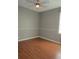 Inviting bedroom with laminate wood flooring and ample natural light at 10198 Oak Crest Rd, Orlando, FL 32829