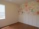 Bedroom featuring charming wallpaper and ample natural light at 10198 Oak Crest Rd, Orlando, FL 32829