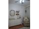 Comfortable Bedroom with changing table, rocker, and floral accents at 10198 Oak Crest Rd, Orlando, FL 32829
