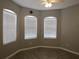 Bright bedroom with three windows offering plenty of natural light at 10198 Oak Crest Rd, Orlando, FL 32829