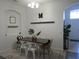 Bright dining area features a modern table set and stylish decorations for a welcoming atmosphere at 10198 Oak Crest Rd, Orlando, FL 32829