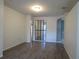Open living area with wood-look floors, neutral walls, and a decorative black paneled divider at 10198 Oak Crest Rd, Orlando, FL 32829