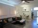 Cozy living room with a comfortable sofa and an open view to the dining area at 10198 Oak Crest Rd, Orlando, FL 32829