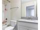Clean bathroom with a bathtub/shower combination, single vanity, and neutral color scheme at 1593 Mulligan Blvd, Davenport, FL 33896
