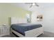 Cozy bedroom with white furniture, a comfortable bed, and a serene atmosphere at 1593 Mulligan Blvd, Davenport, FL 33896
