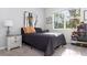 Comfortable bedroom with ample natural light, neutral color palette, and stylish decor at 1593 Mulligan Blvd, Davenport, FL 33896