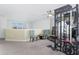 Spacious loft featuring exercise equipment, ample natural light, and comfortable seating at 1593 Mulligan Blvd, Davenport, FL 33896