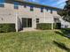 A private backyard with a grassy lawn, patio, and privacy fence at 1106 Presidential Ln, Apopka, FL 32703