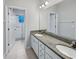 Bathroom with double vanity, granite countertop, and walk-in shower at 1106 Presidential Ln, Apopka, FL 32703