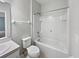 Bright bathroom with a shower and tub combination, standard toilet, and vanity sink at 1106 Presidential Ln, Apopka, FL 32703