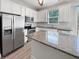 Modern kitchen with stainless steel appliances and granite countertops at 1106 Presidential Ln, Apopka, FL 32703
