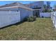 Spacious backyard with a well-kept lawn and white privacy fence at 14053 Wild Majestic St, Orlando, FL 32828
