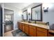 Elegant bathroom with double sinks and granite countertops at 2399 Parkside Glen Dr, Apopka, FL 32712