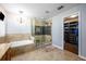 Bathroom with a walk-in shower and adjacent closet at 2399 Parkside Glen Dr, Apopka, FL 32712