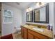 Bathroom with double sinks and granite countertops at 2399 Parkside Glen Dr, Apopka, FL 32712