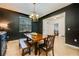 Bright dining room with a chandelier and wooden table at 2399 Parkside Glen Dr, Apopka, FL 32712