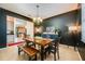 Rustic dining room with dark walls and a wooden table with benches at 2399 Parkside Glen Dr, Apopka, FL 32712