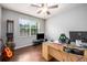 Home office featuring wood floors and a large window at 2399 Parkside Glen Dr, Apopka, FL 32712